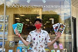 Steven Penkevich in front of Reader's World in downtown Holland. 