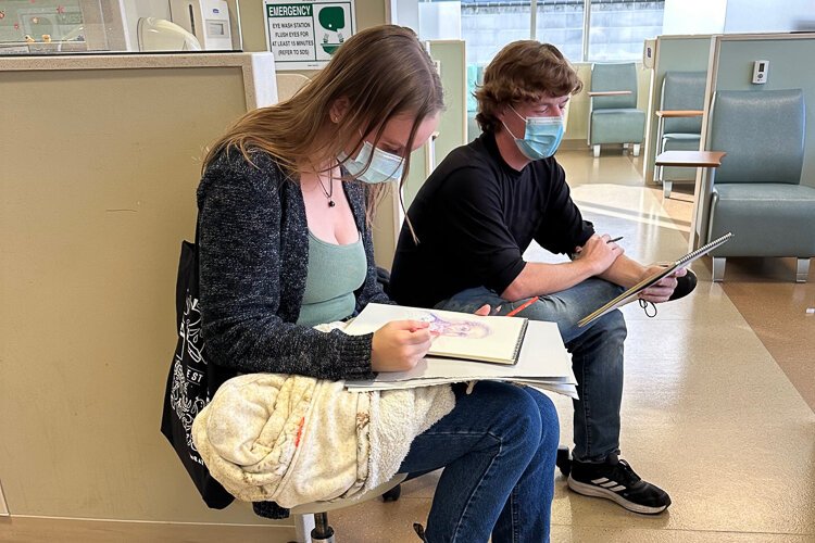 Students from the Kendall College of Art and Design of Ferris State University sketch patients at Corewell Health's Lemmen-Holton Cancer Pavilion.