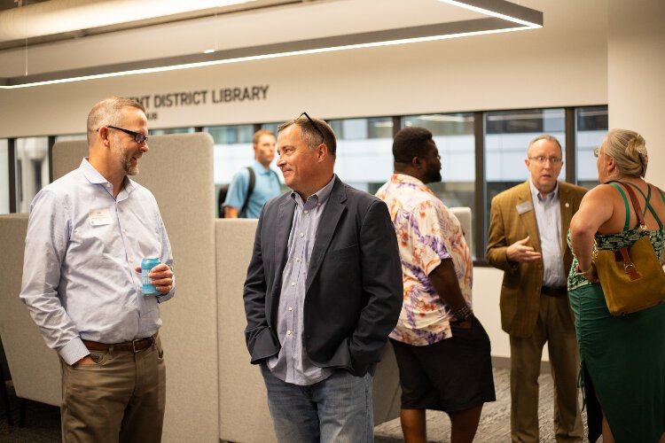 People talk during a KDL Work Hub open house.