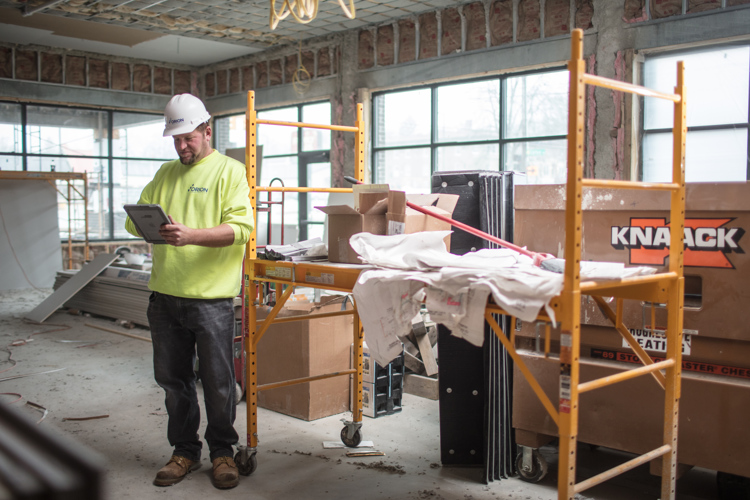 Jamie Baltruczak uses a tablet to manage his jobsite for Orion Construction.