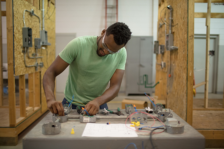 Chris Kellie learns skilled electrician work at GRCC.