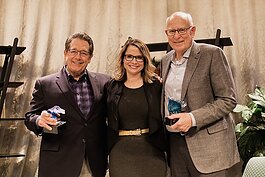 Philanthropists Jim Brooks (left) and Dick Haworth received the Visionary Award from Lakeshore Advantage President Jennifer Owens.