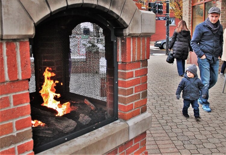 Downtown Holland's fireplace is a favorite place to warm up on a chilly day. 