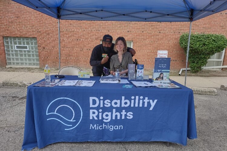 Kristen Milefchik with a participant at a Disability Rights Michigan event. 