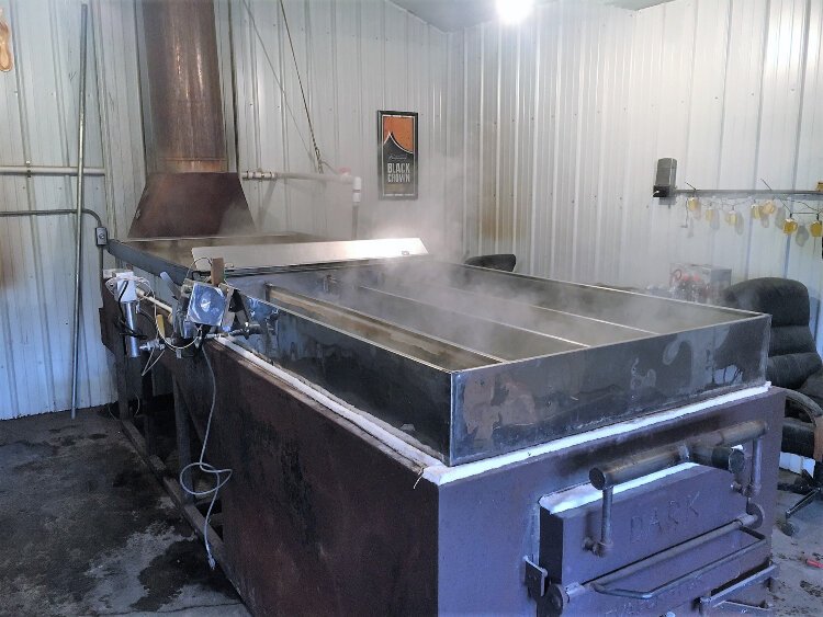 Evaporator boiling water off sap creates a lot of steam. The partners build most of their own equipment.