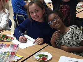 Students taste strawberry and spinach salad in a SPLASH/Nutrition program at Hughes Elementary in Marshall.