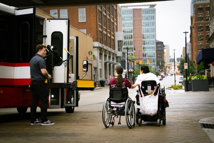 Around 60 contestants, caregivers, and staff rode Hope Network’s six red buses for a Grand Rapids competition outing.