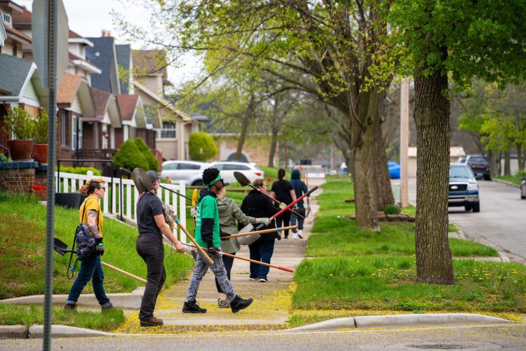 Volunteers walking to planting sites, ArborFest 2024, photo by Tiffany Fant (Mo'Photography LLC).