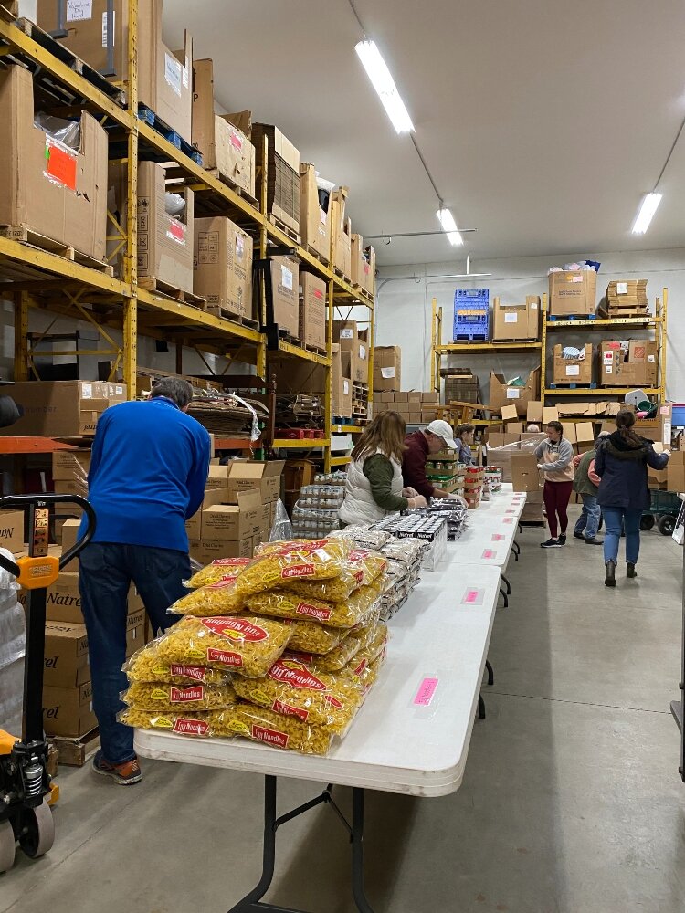 Volunteers at Love in Action of the Tri-Cities organized food to give to those in need.