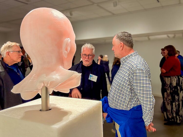 Artist Barry X Ball (second from right) with guests in front of his Hester Diamond (2015 – 2024), from BUSTED: Contemporary Sculpture Busts’ opening reception.