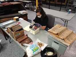 Margaret Paxton, Assistant to the Curator of Collections, works at the Community Archives and Research Center.