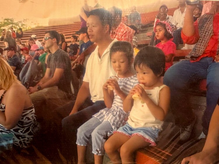 Christina Le as a child with her dad and sister. 