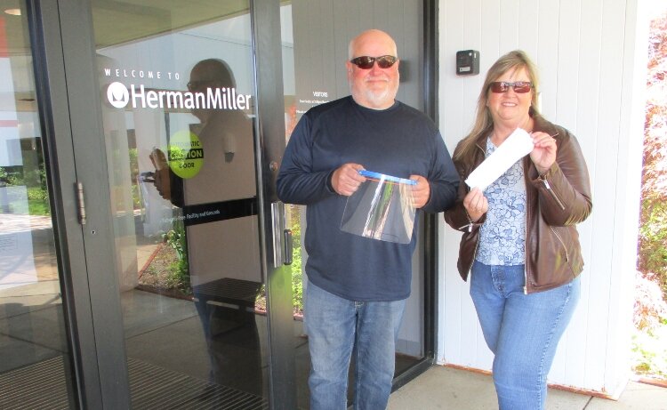 Penny Garlock with her husband, Mark, who is also an employee at Herman Miller and has helped with the PPE project. 