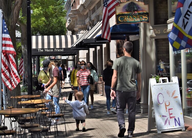 Visitors to Holland fill the sidewalks with the reopening of downtown.