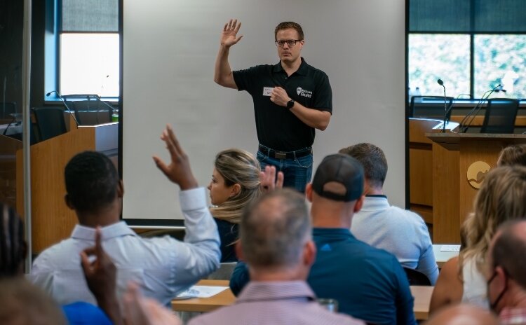 Nathan Biller speaks at the first ADU boot camp hosted by his new company, MI Backyard Build, drawing more than 50 homeowners, real estate professionals and city staff.