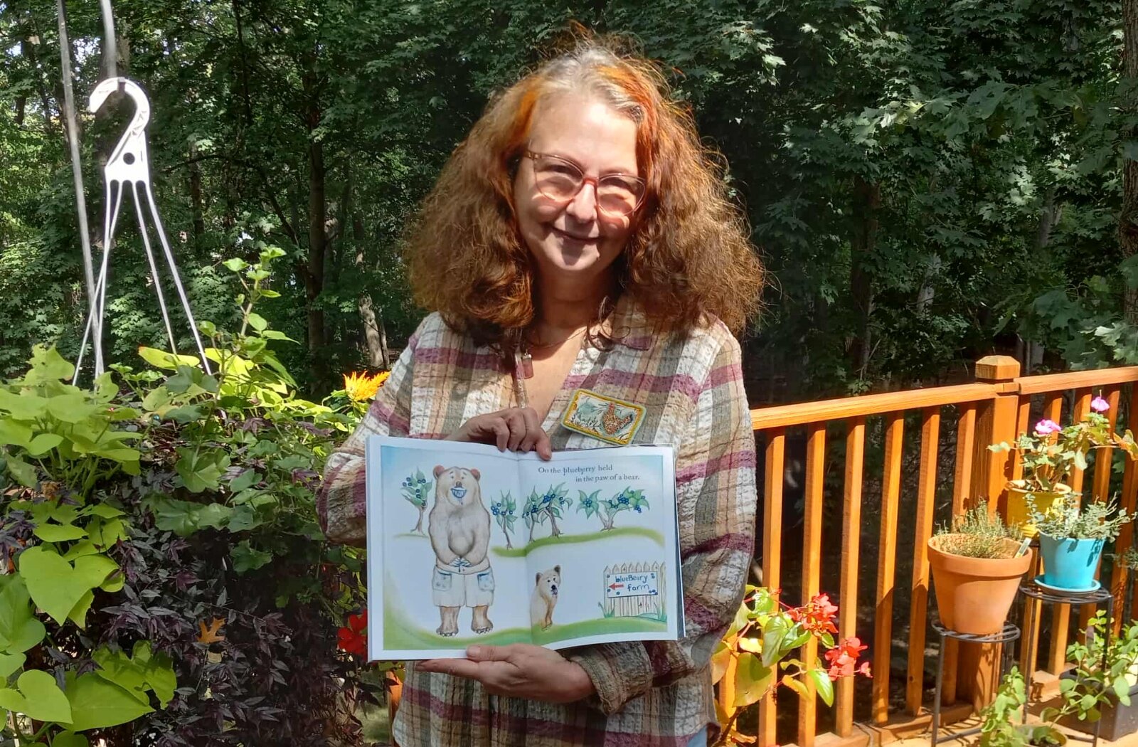 Estelle Slootmaker with her new children’s book, Places Where the Sun Don’t Shine.