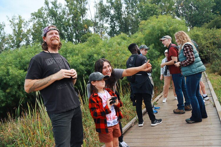 Nicole Perkins (third from the left) and her family enjoy city events that combine education and fun.