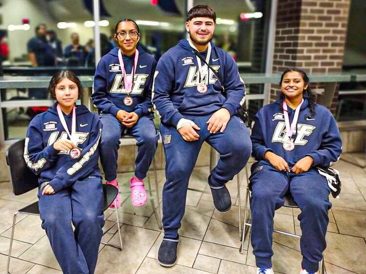  Lee High School athletes show off their medals. 