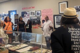 Grand Rapids African American Museum and Archives Executive Director George Bayard III leads a tour.