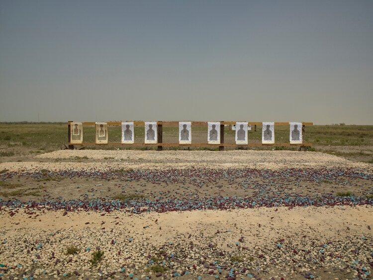 A photo in the “Border Cantos | Sonic Border" exhibit shows the landscape with shooting targets at the Mexican border. 