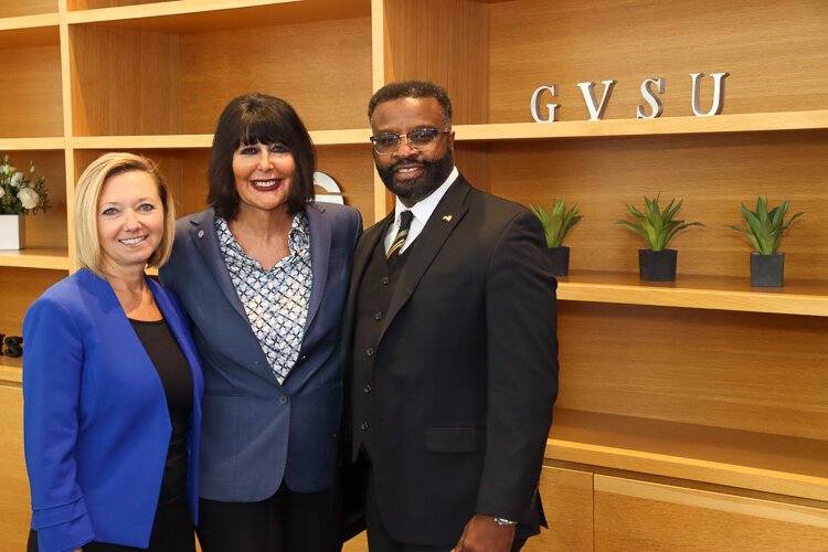 Mayor Rosalynn Bliss, GVSU President Philomena V. Mantella, and Grand Rapids City Manager Mark Washington celebrate the opening of the downtown Laker Store.