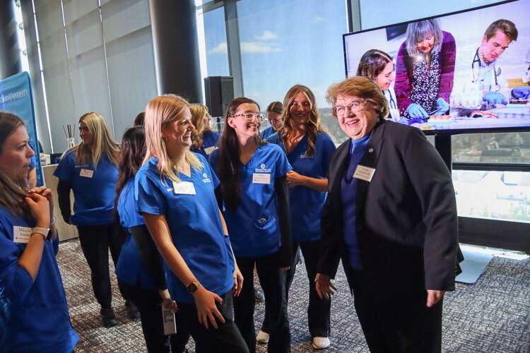 Dean Linda Lewandowski of the Kirkhof College of Nursing joins in the celebration with the nursing graduates of 2025 at the Daniel and Pamella DeVos Center for Interprofessional Health.