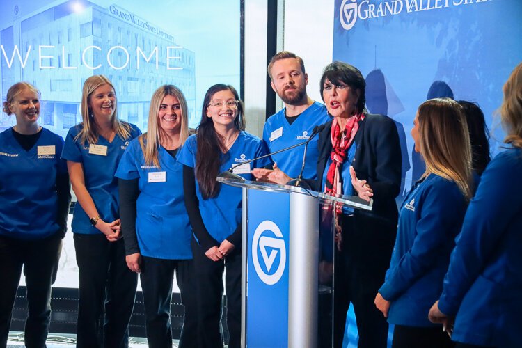 Surrounded by members of the 2025 class, GVSU President Philomena V. Mantella shares the success of the DCIH.