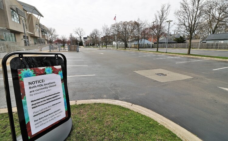 Empty parking spaces symbolize the closing of Herrick District Library in Holland.