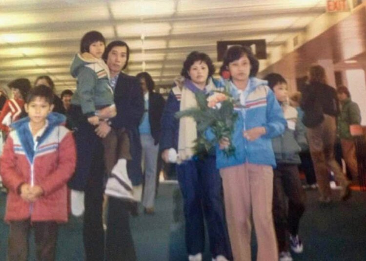 Jennifer Pham’s grandfather, Xinh Van Pham, reunites with his wife, father, and siblings on Dec. 23, 1984, after nine years apart.