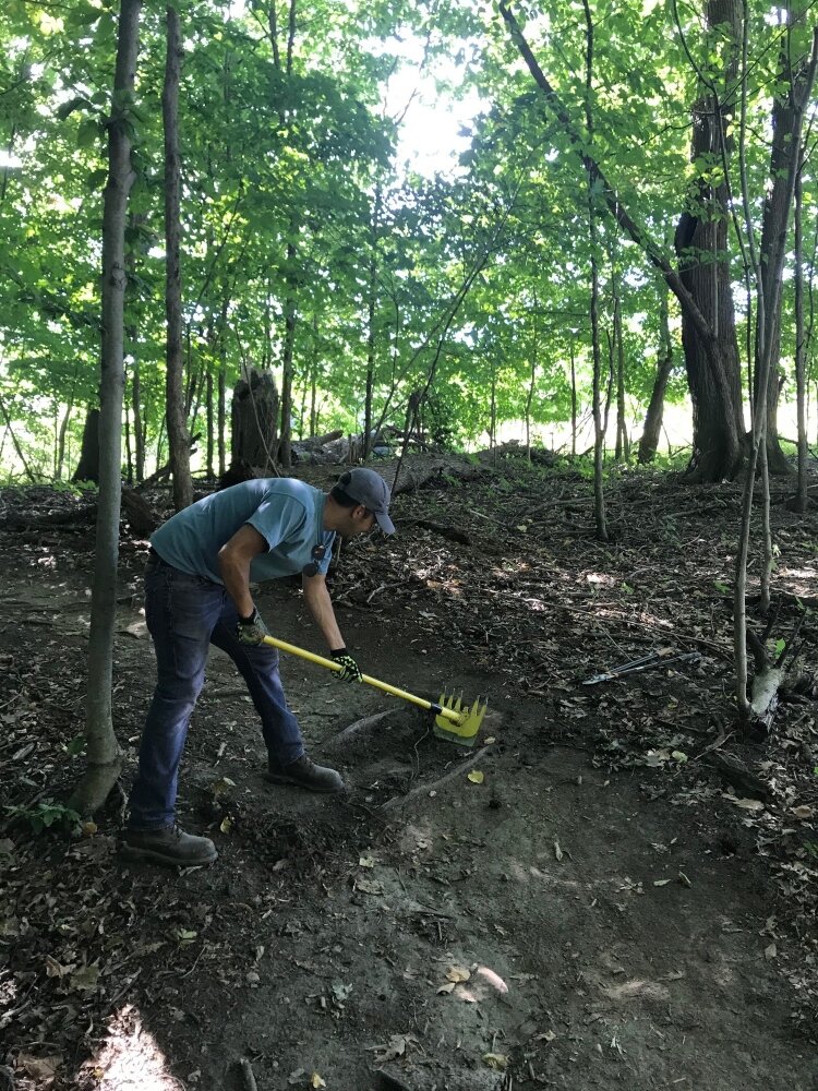 A DISHER employee volunteers his time, working on a trail. 