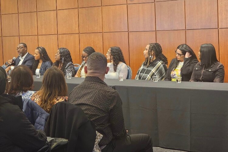 Executive producer Kris Mathis leads a panel discussion with the "Let's Help Her Win" team and participants following the show's premiere.