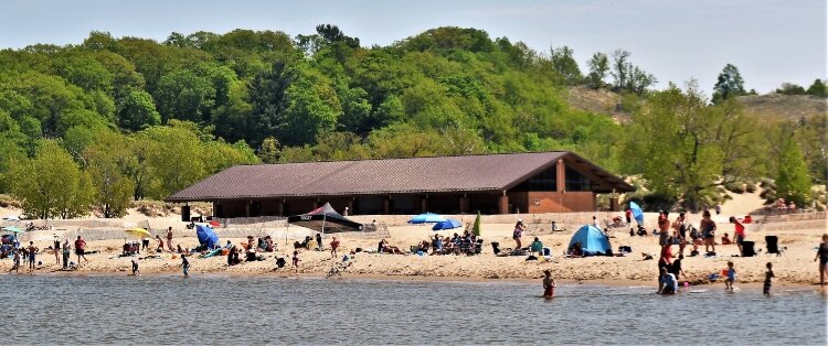 Pandemic restrictions limited Memorial Day attendance at Holland State Park.