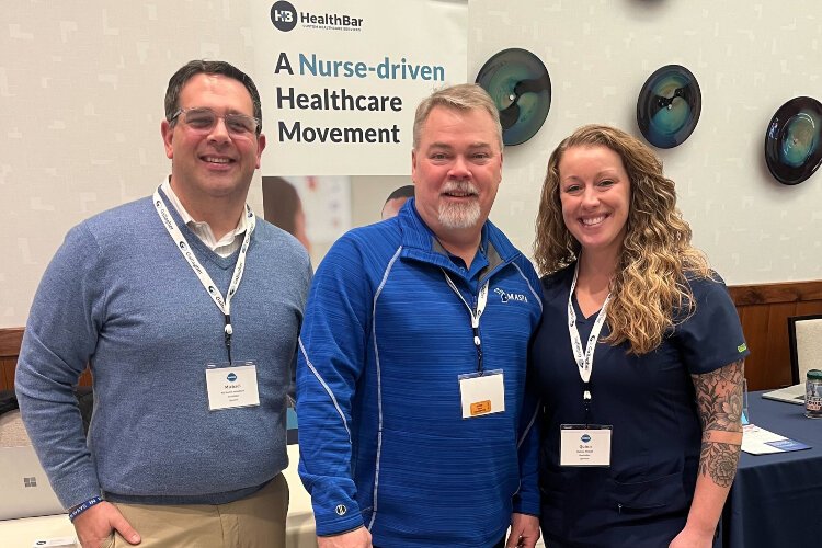 (Fom left) HealthBar Director of Sales and Marketing Michael Lomonaco, Rick Arnett with Lake Orion Public Schools, and HealthBar School Nursing Program Manager Quinn McGill.