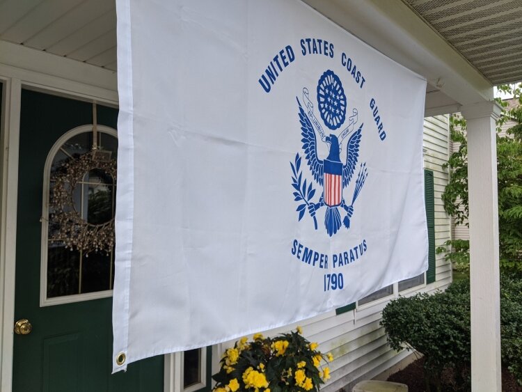 Even without a festival this year, the Moroney family is honoring the U.S. Coast Guard by flying its flag.