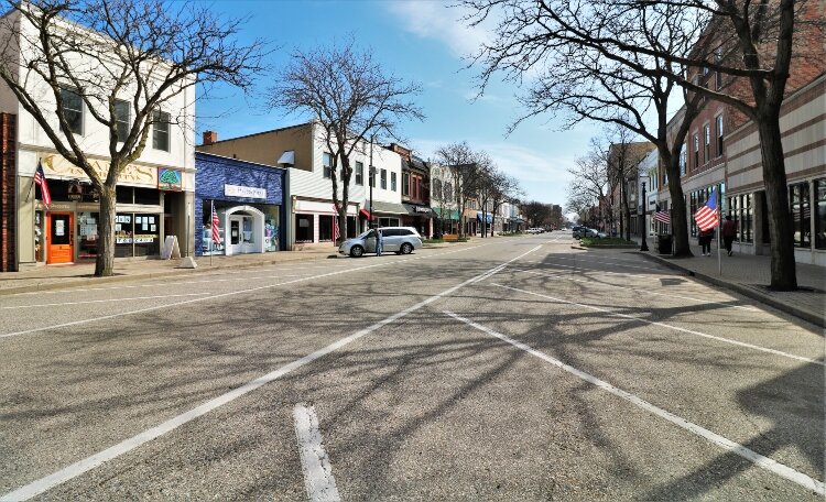 Usually scarce on a Saturday, parking space along 8th Street in downtown Holland is abundant during the pandemic.