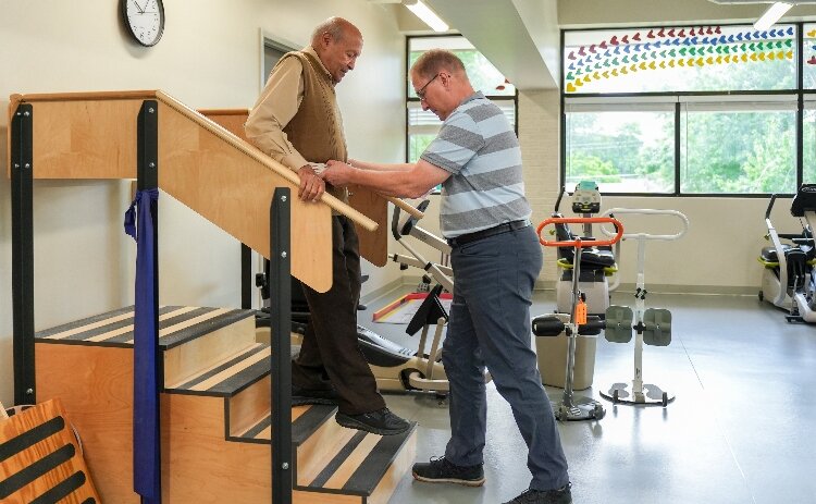 Physical Therapist Peter Vander Weide working with participant Anwar.