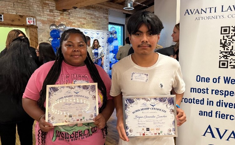 Union High School seniors Shinya Stevenson and Bryan Gonzalez Sanchez proudly display their scholarship awards.