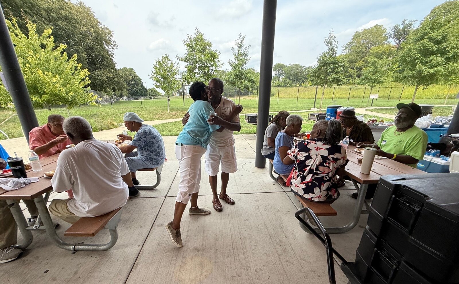 Reunion organizer Teri Ann (Calmese) Jones hugs a friend.