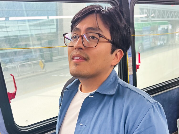 Ken Miguel-Cipriano reads facts about The Rapid bus.