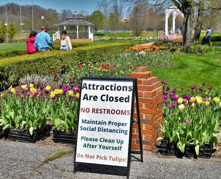 The signs at Windmill Island reminded visitors that the pandemic restricted activities at the park.
