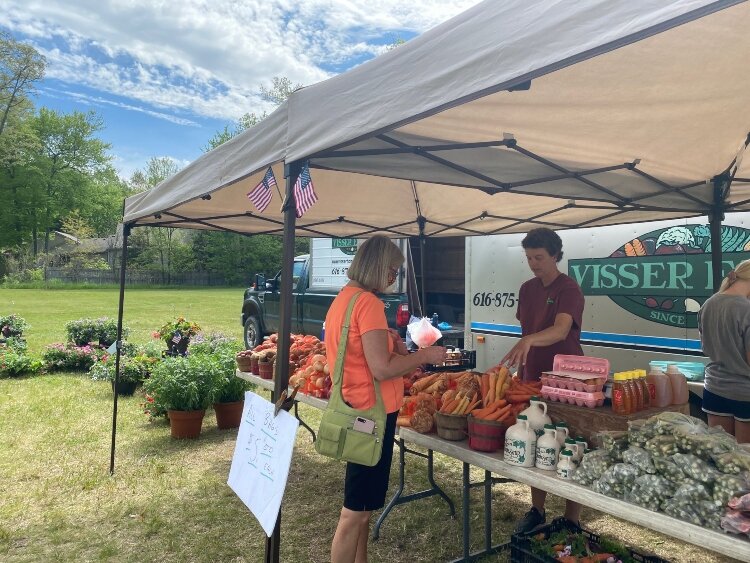 Visser Farms now operates a stand at Waukazoo Market on Holland's northside. 