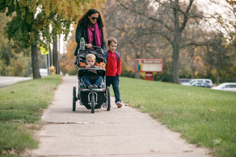 Meryl Herr and her sons Jeremiah and Caleb walk home from school.