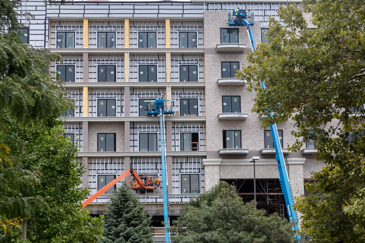 Construction workers build the new Embassy Suites on North Monroe.