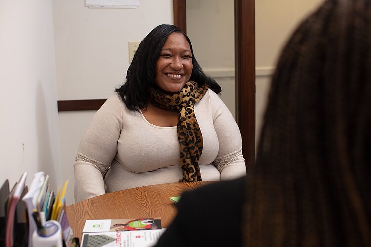 Candance Walton talks with a New Beginnings Co-ordinator.