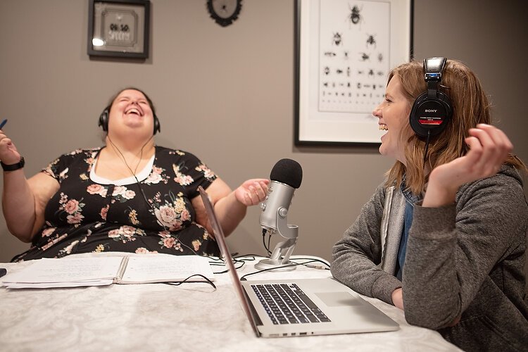 Cate Reed, left, and Jen Vos record This Podcast is Haunted.