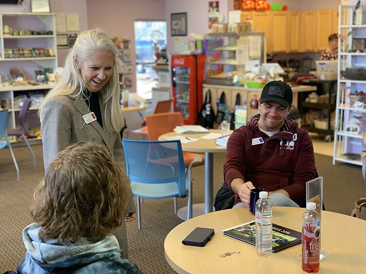 Barbara Lee VanHorssen talks to members of the Momentum Center. 