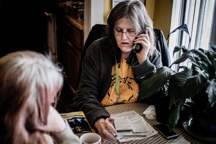 A Lemonade Stand member helps a friend get connected to various housing options. Many Stand members have had experience with homelessness, often due to the cost of housing and the inability to hold down steady employment due to their mental health an