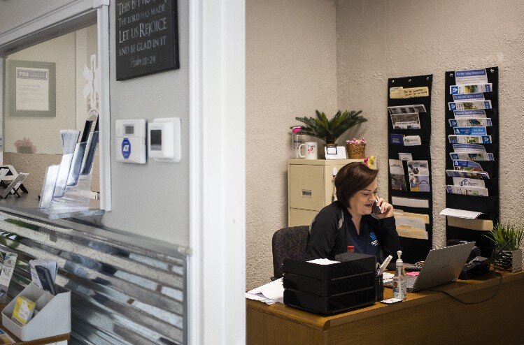 Adrienne Schmitt takes a phone call inside Gateway Healthcare.