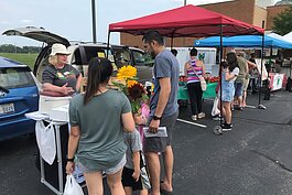 KISD Nutrition Educator Amy Klinkoski at the Kentwood Farmers Market at the Kent District Library's Kentwood branch.