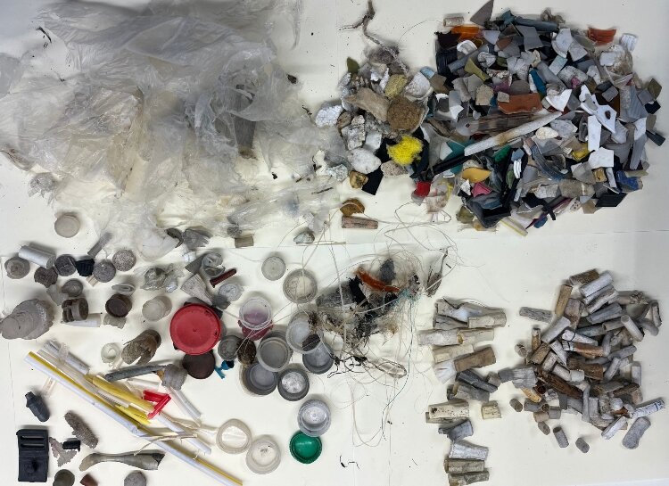 Tiny pieces of trash picked up from a beach by the Bebot drone.